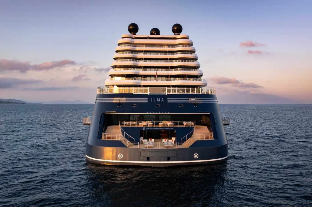 Infinity pool deck on The Ritz-Carlton Ilma yacht at sunset with ocean views
