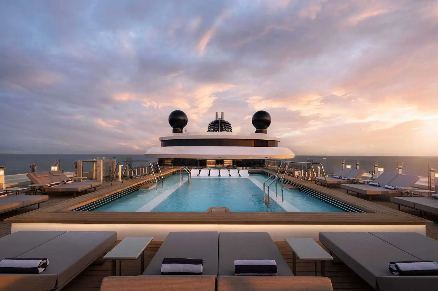 Luxury outdoor pool and lounge area on The Ritz-Carlton Yacht Collection